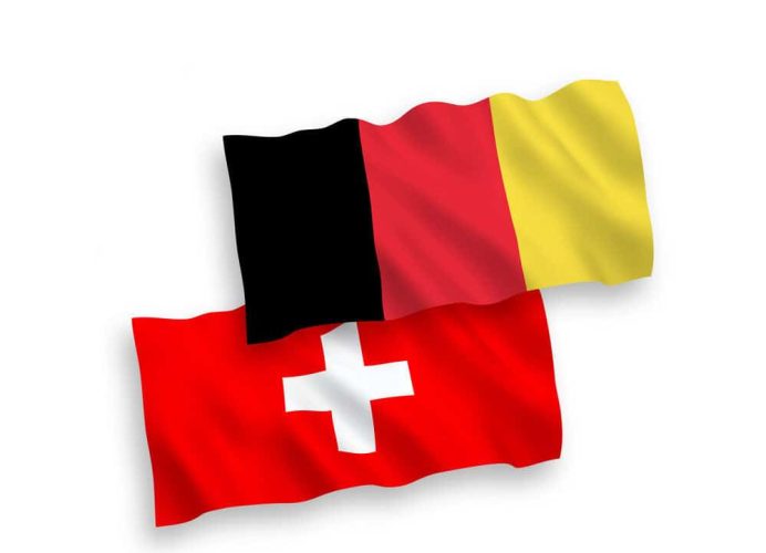 National vector fabric wave flags of Switzerland and Belgium isolated on white background. 1 to 2 proportion.