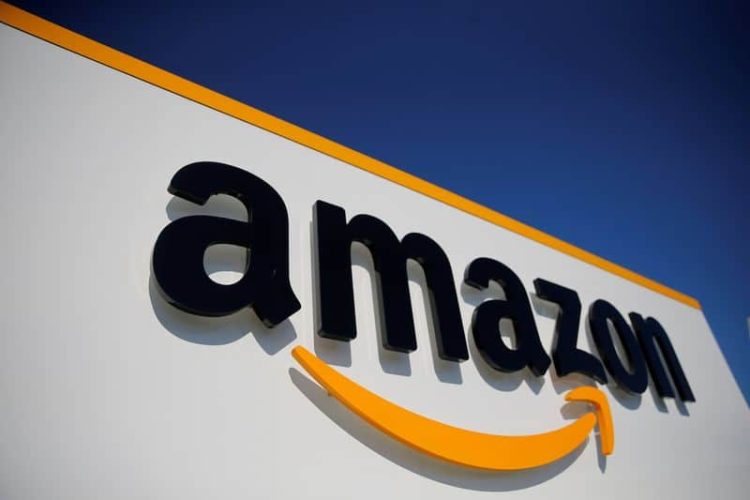 FILE PHOTO: The logo of Amazon is seen at the company logistics center in Lauwin-Planque, northern France, April 22, 2020. REUTERS/Pascal Rossignol