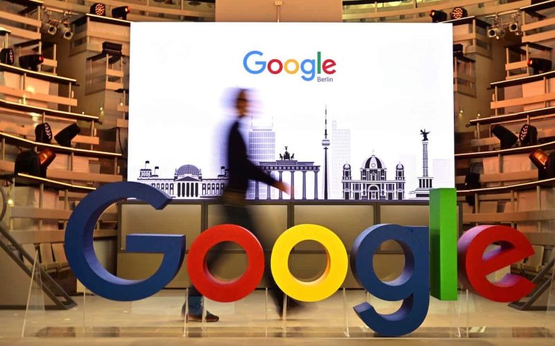 A technician passes by a logo of US internet search giant Google during the opening day of a new Berlin office of Google in Berlin on January 22, 2019. (Photo by Tobias SCHWARZ / AFP)        (Photo credit should read TOBIAS SCHWARZ/AFP/Getty Images)